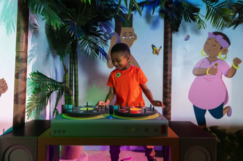 The beach party DJ decks, one of the interactive games in the installation, featuring a track skip button and interactive LED lighting and sounds.